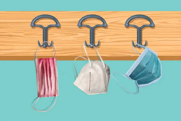 Vector illustration of Face protective masks hanging on a coat rack