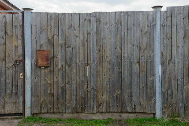 istock An old wooden gate with a rusty mailbox 1311395890