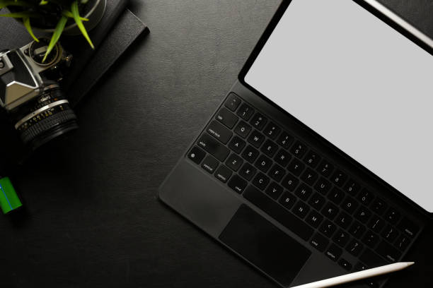 istock Creative workspace with digital tablet, accessories, camera, supplies and copy space, top view 1311396298