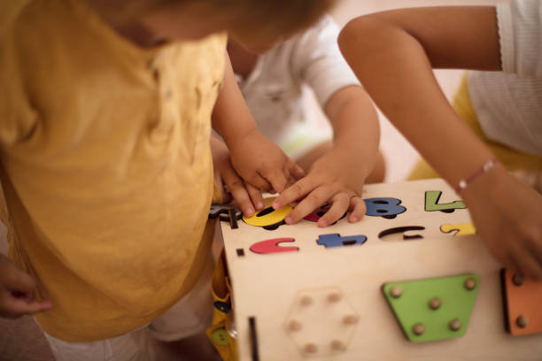 istock Brothers and sister playing at home. 1311397659