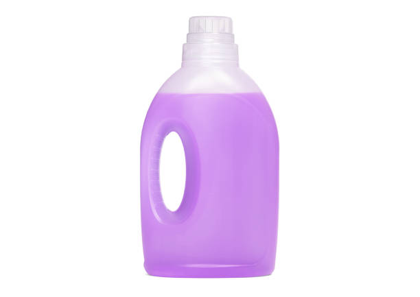 istock Detergent bottle, purple liquid washing soap for textile, isolated on white 1311398385
