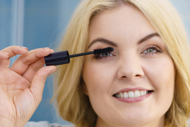 istock Woman using mascara on her eyelashes 1311398800
