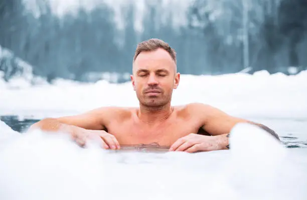 Photo of Winter swimmer in cold water in winter