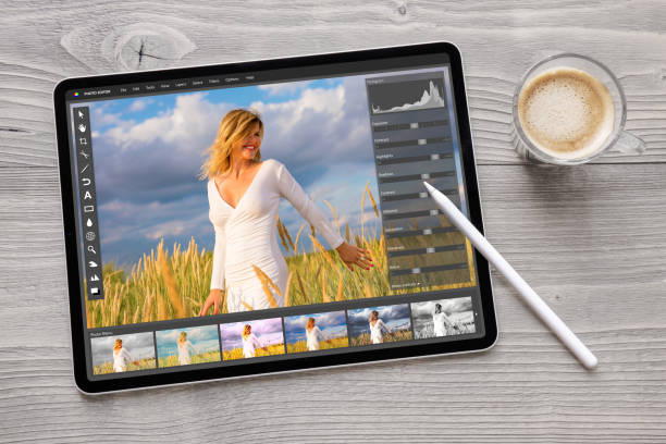 Concept of digital photo editing on tablet computer with wireless stylus pen Concept photo from above of digital photo editing on tablet computer with wireless stylus pen retouching stock pictures, royalty-free photos & images