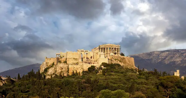 Athens, Greece. Acropolis and Parthenon temple, top landmark. Scenic view of ancient Greece remains from Philopappos Hill, cloudy sky background.