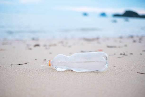 istock plastic Bottle garbage on the beach. Ecology,  Environmental, pollution and Ecological problem concept 1311402548