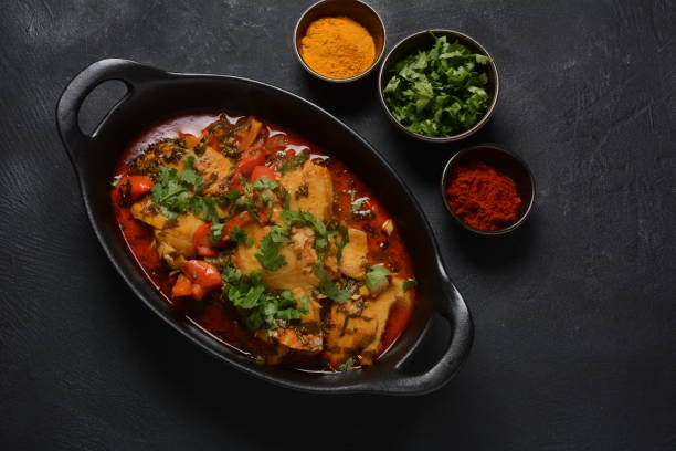 istock Moroccan fish  with chermoula, red peppers and preserved lemon. 1311405017