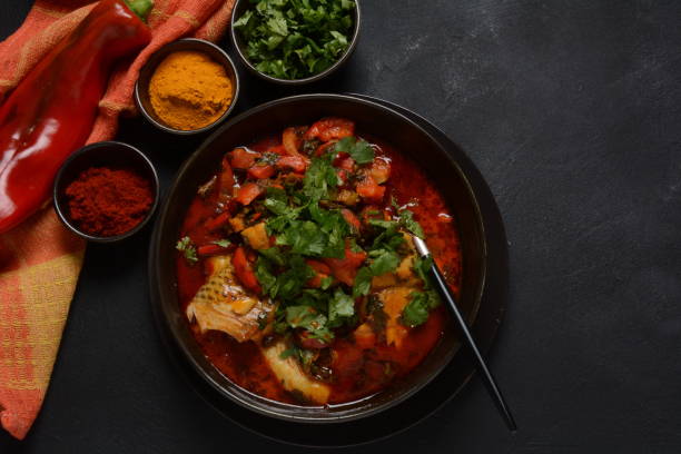 istock Moroccan fish  with chermoula, red peppers and preserved lemon. 1311405081