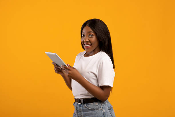 istock Positive black woman with modern digital tablet 1311406485