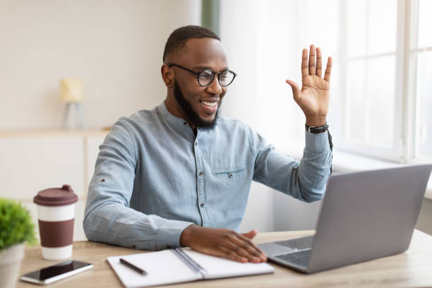 istock Black Business Guy Making Video Call On Laptop In Office 1311406694