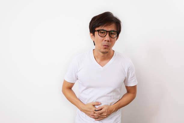 istock Middle aged Asian man suffers from stomach ache 1311408666
