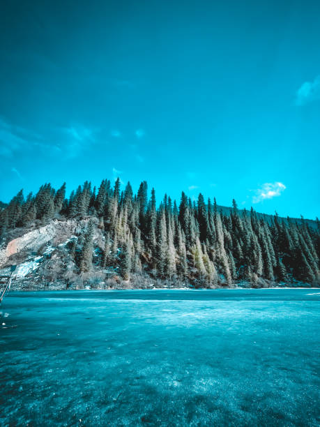 The lake around the mountains in winter
