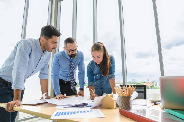 istock Engineers team meeting for architectural project. architects discussing blueprint with construction manager in office worker conference site. Construction Concept 1311413646