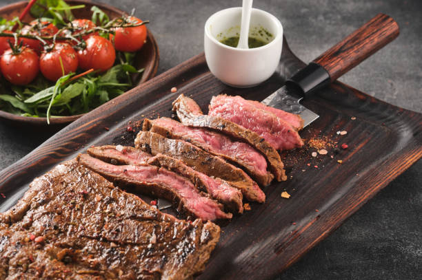 Barbecue dry aged wagyu flank steak sliced Barbecue dry aged wagyu flank steak sliced. flank steak stock pictures, royalty-free photos & images