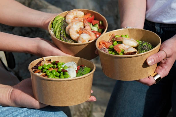 istock Poke bowls in takeout boxes. 1311416282