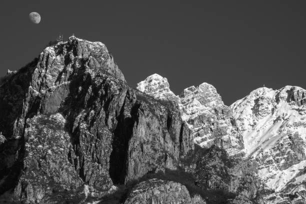 istock THE MOON RISES ABOVE MOUNT RESEGONE 1311418517