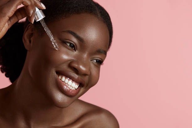 istock Girl dropping serum collagen moisturizer on face 1311419219