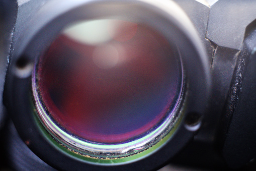 Close-up of a sniper rifle telescope glass lens.