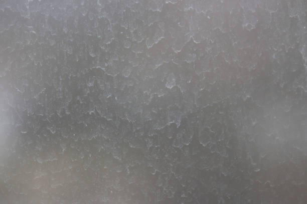 istock Dirty gray window glass selective focus. 1311421409