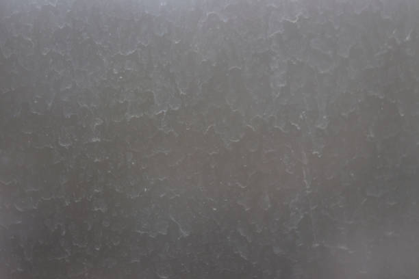 istock Dirty gray window glass selective focus. 1311421602
