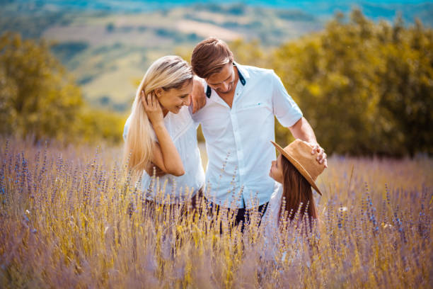 istock Young family in lavender field. 1311422525