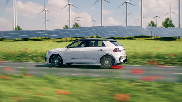generic autonomous electric car driving through the green countryside