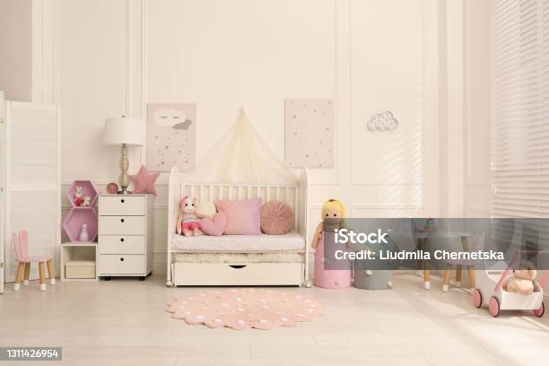 Cozy Baby Room Interior With Crib And Toys Stock Photo - Download Image Now - Apartment, Bed - Furniture, Bedroom