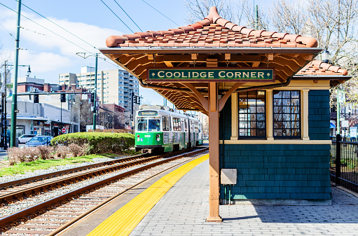 Brookline, Massachusetts, USA - April 2, 2021: Coolidge Corner train stop on the MBTA (Massachusetts Bay Transportation Authority) Green Line. In Brookline this line runs along Beacon Street.
