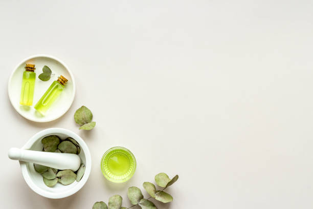 istock Essential oil in glass bottle, herbs with eucalyptus. Space for text 1311430044