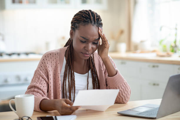 istock African American Female Freelancer Having Stress While Working With Papers At Home 1311430924