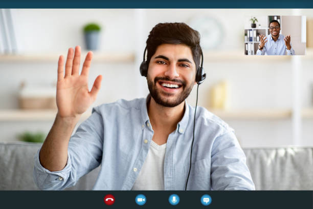 istock Remote distant communication. Arab man in headphones having video online conference with colleague, monitor screenshot 1311431325
