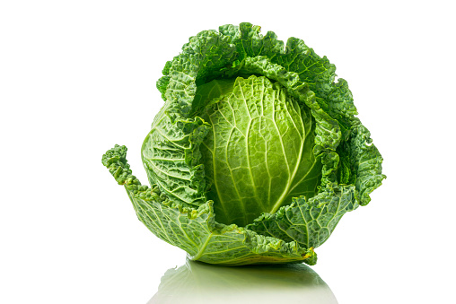 Green Savoy cabbage with reflection isolated on white background
