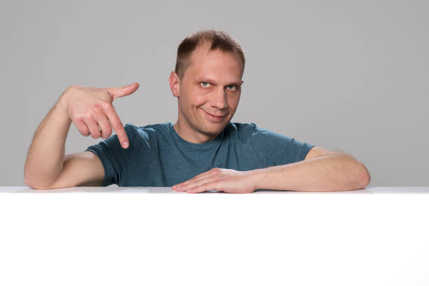 istock Portrait of mature man pointing finger 1311431865
