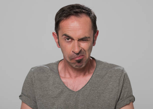 istock Portrait of man winking eye 1311432464