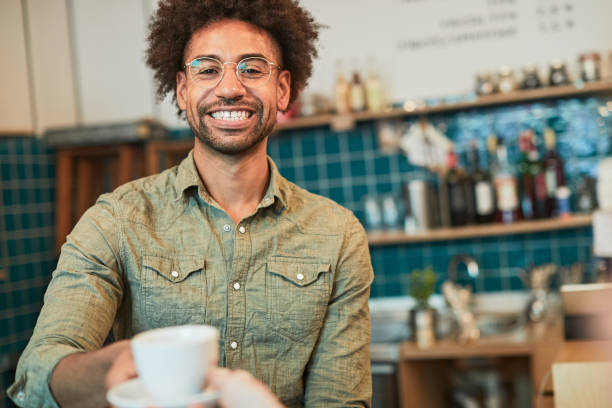 istock A barista serving coffee in a shop 1311433457
