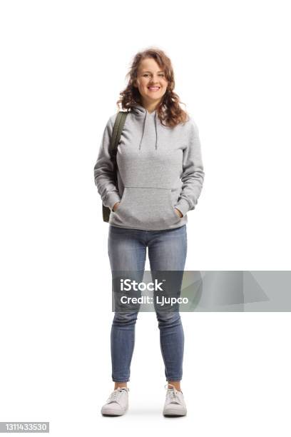 Full Length Portrait Of A Female Student Standing And Smiling At The Camera Stock Photo - Download Image Now