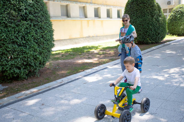 istock Mother with her three children  in a walk 1311434814