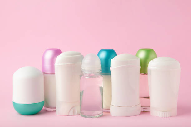 istock Different deodorants on pink background, top view. Skin care 1311435461