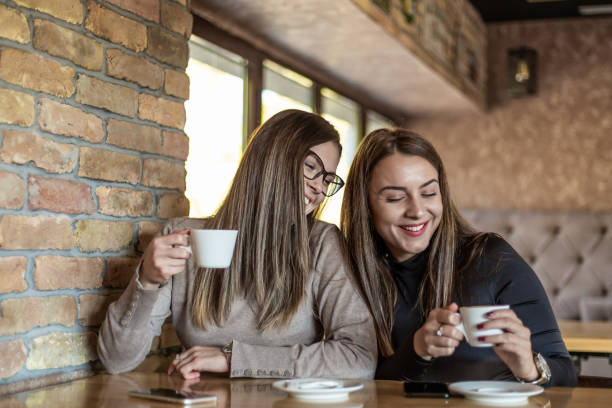istock Two cheerful women having fun during a coffee in a cafe. 1311436446