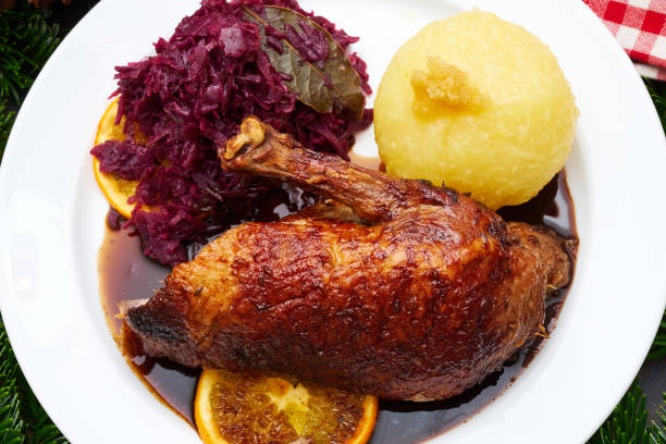 istock Whole fried duck for Christmas with side dishes 1311436458