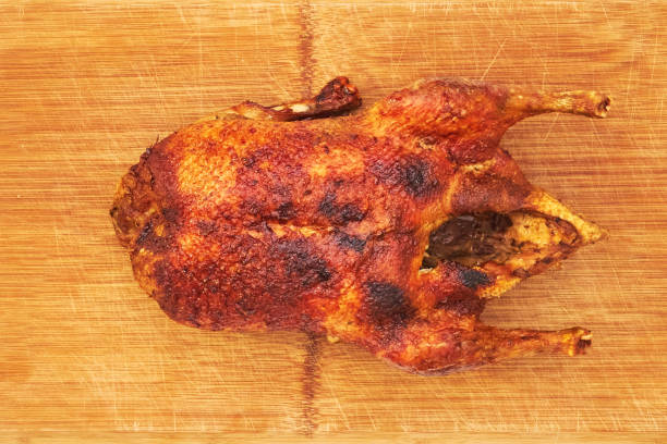 istock Whole fried duck for Christmas with side dishes 1311436516