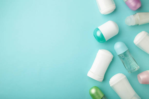 istock Different deodorants on blue background with copy space, top view. Skin care 1311436674