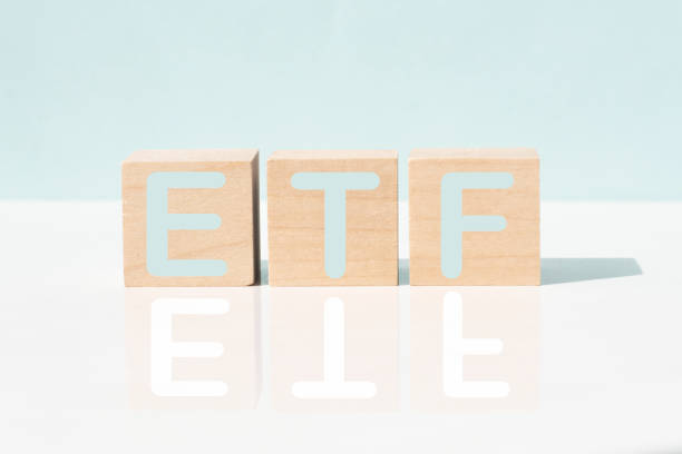 ETF word made of wooden cubes on a white background , business concept The word ETF exchange-traded fund made of wooden cubes on a white background , business concept exchange traded fund stock pictures, royalty-free photos & images