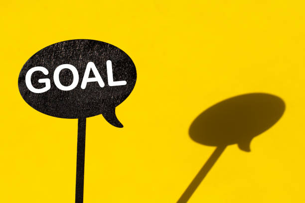 istock the word goal on a black board on a yellow background 1311436983