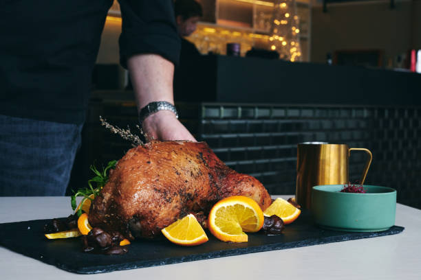 istock Whole fried duck for Christmas with side dishes 1311437331