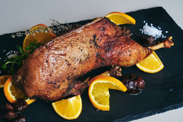 istock Whole fried duck for Christmas with side dishes 1311437459