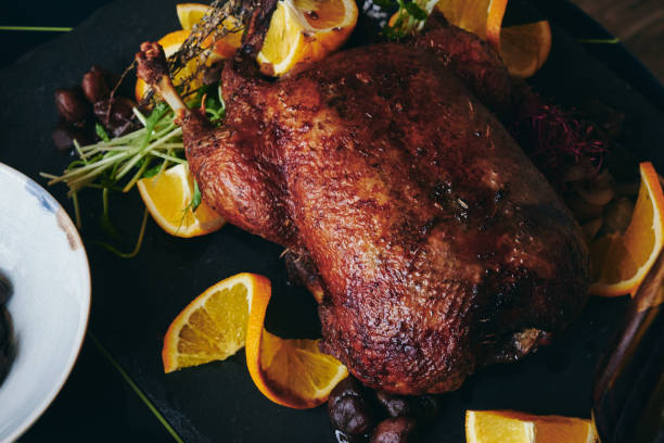 istock Whole fried duck for Christmas with side dishes 1311437563