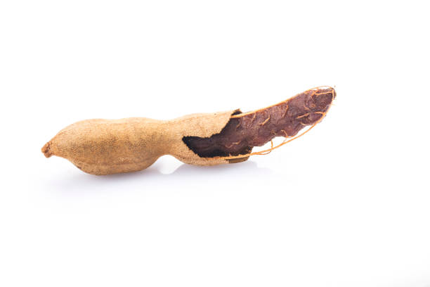 istock Tamarind (Tamarindus indica) fruit isolated on white background 1311438736