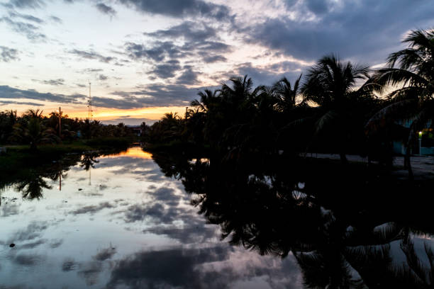 istock Sunset over Dangriga river in Dangriga town, Beli 1311439319