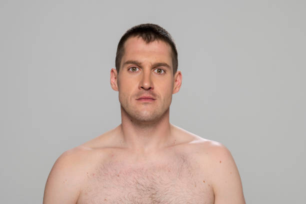 istock Portrait of man against grey background 1311439504